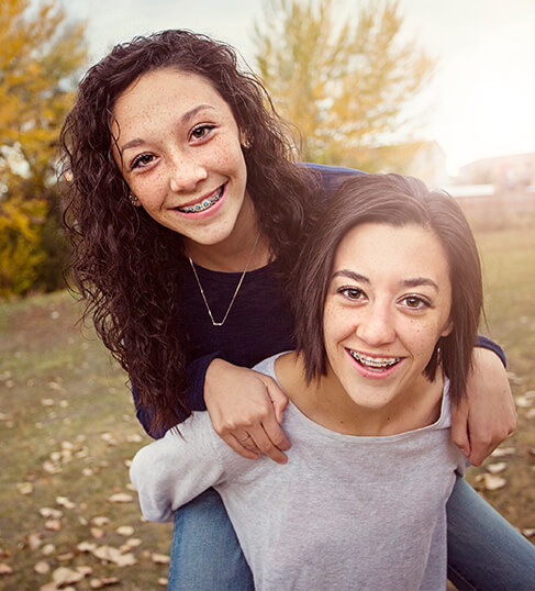 two teenage girls with braces
