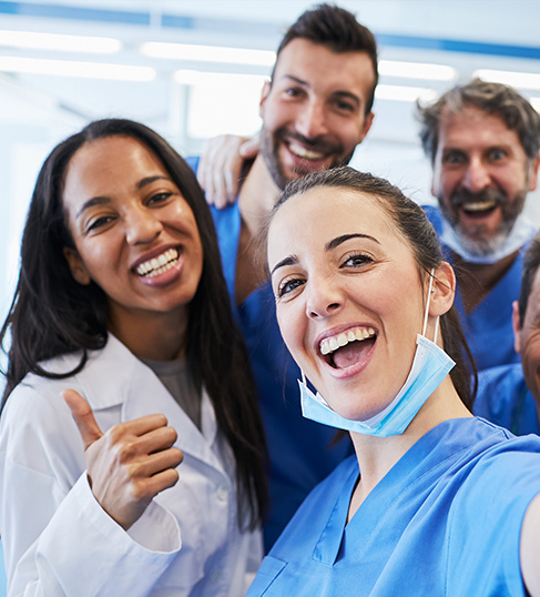 dental staff smiling for selfie
