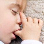 young child thumb sucking which can increase need for orthodontic treatment