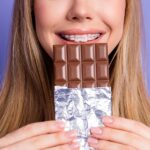 girl in braces at Halloween in chocolate