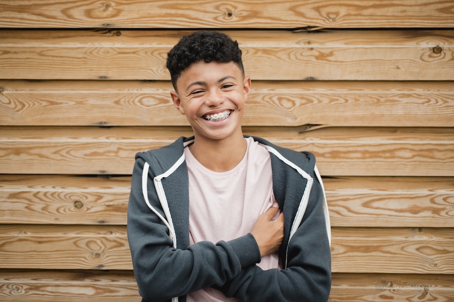 teen smiling confidently with braces