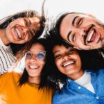 group of friends smiling and one has braces in 2026