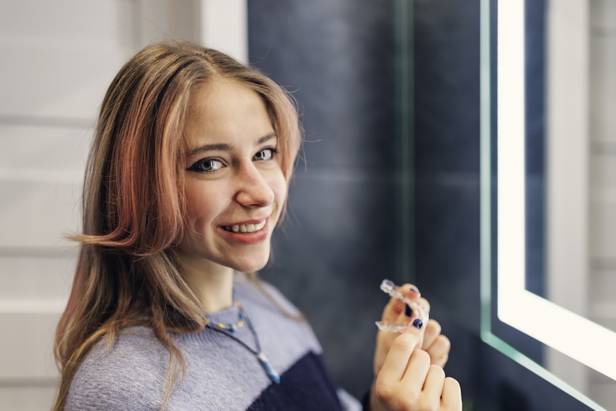 teen with clear aligners, clear aligners for students