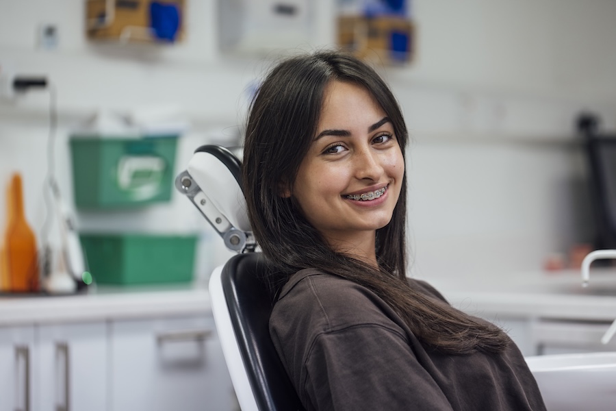 teen girl with braces vs clear aligners